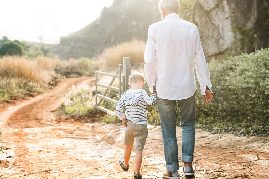Granddad and Grandson Walking Together
